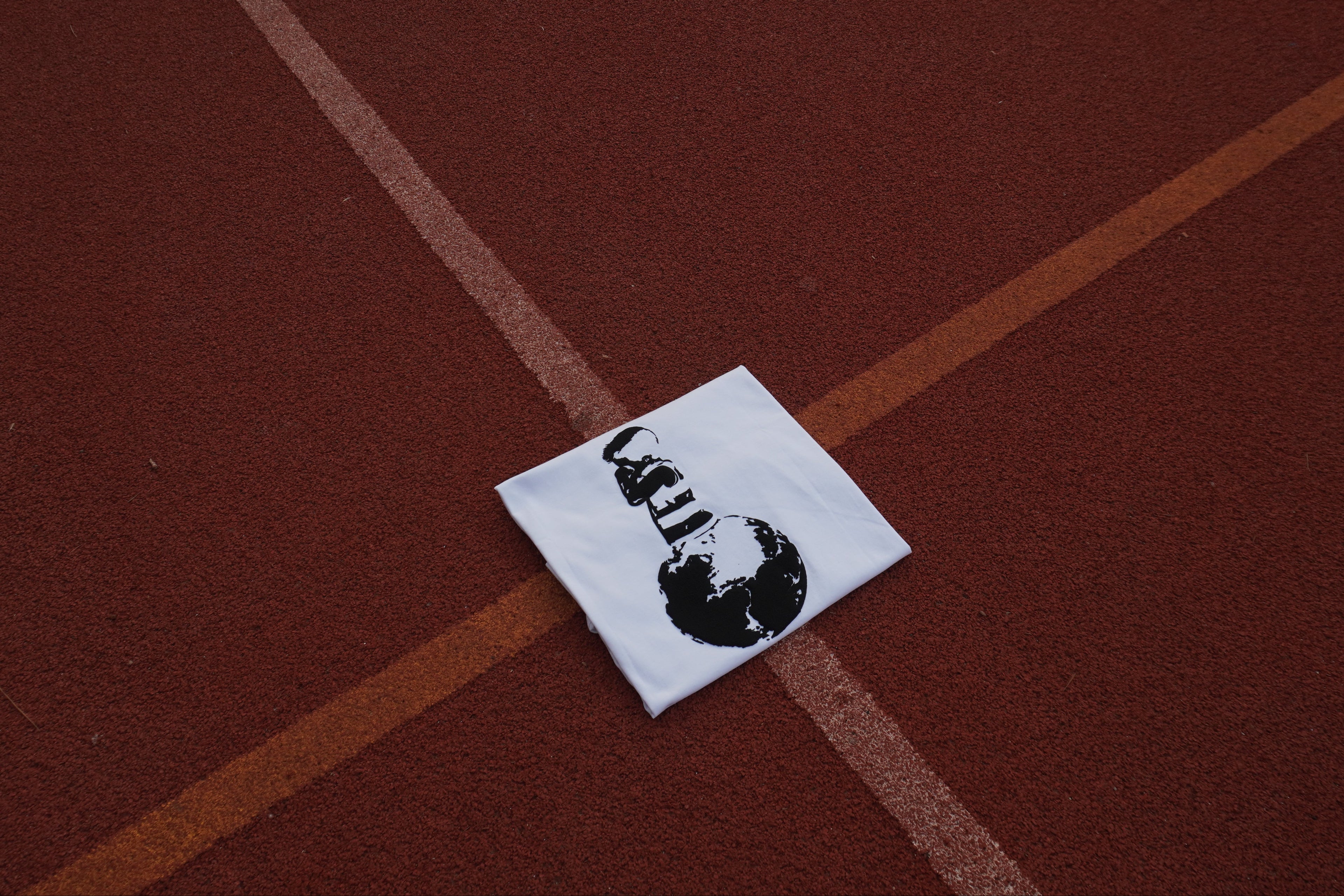 Small white square with black design on a brown surface